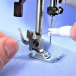 Enhebrador de máquinas de coser